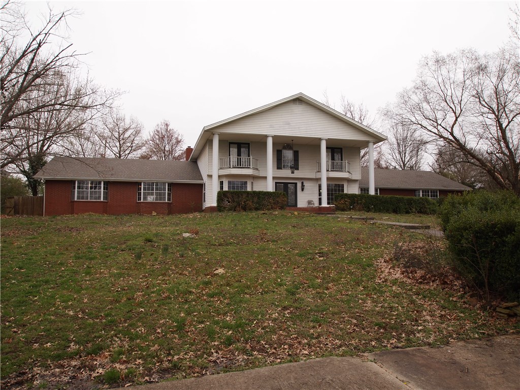 Estate home on 4.48 park like acres less than 1 mile away from Bentonville square. Many possibilities with this property. Could be a development, event center, or keep it as an estate home. 5,972 SF home with an additional 1,500 SF indoor pool. Fresh interior paint, brand new roof, brand new HVAC systems, new carpet and resurfaced hardwood flooring. Purchase this home and make it your own with updating kitchen and baths to your specifications. Rare opportunity to own a large estate in the heart of Bentonville. Property borders the original Wal-Mart Supercenter to the south. Lots of seclusion, convenient to everything Bentonville has to offer. Most recently was a bed and breakfast.