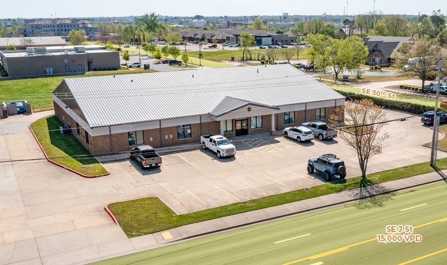 This flex/warehouse/office is located on the corner of SE J St (15,000 VPD) & SE 30th St with approximately 206' of frontage on SE J St. The building consists of ±7,085 SF of open retail/showroom and office space, ±699 SF of office space on the 2nd floor plus additional storage area, and ±5,226 SF of warehouse/storage space. Class A dock with roll up door located in the rear of the building and an 8' x 10' overhead drive-in door on the south side of the building. New roof was installed 5 years ago. 1.2 miles to the new Walmart Campus and 1.1 miles to I-49.