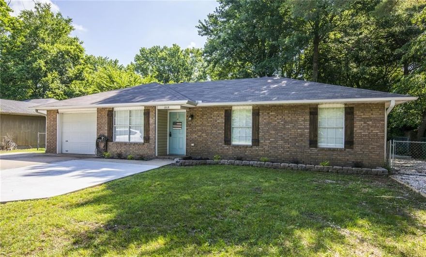 Impressively remodeled 3BR, 2BA home. Laminate floors, open floor plan to kitchen, dining & family room, wet bar, new paint, SS appliances, modern fixtures, updated BA's w/new vanities/fixtures. Breakfast nook opens sliding glass doors to the back deck. Backyard perfect for entertaining, extremely large & spacious, mature trees with lots of shade, horseshoes already set up, extra large shop building for storage or man cave/she shack, extra parking on side of house. 1 car garage with built-ins, decent size utility.