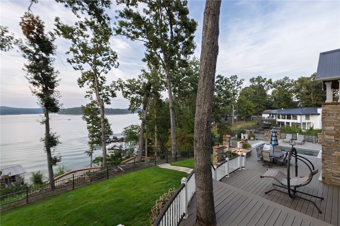 Experience Lakefront living at its finest!  This property contains incredible lake views all season long! Recent renovations leave little to be desired.  Private two slip dock, heated swimming pool with automatic cover, multiple outdoor living areas for entertaining. Inside you will find two spacious living areas, steam room, wood burning stove and plenty of room for guests! Just minutes from downtown Rogers this one is a must see!