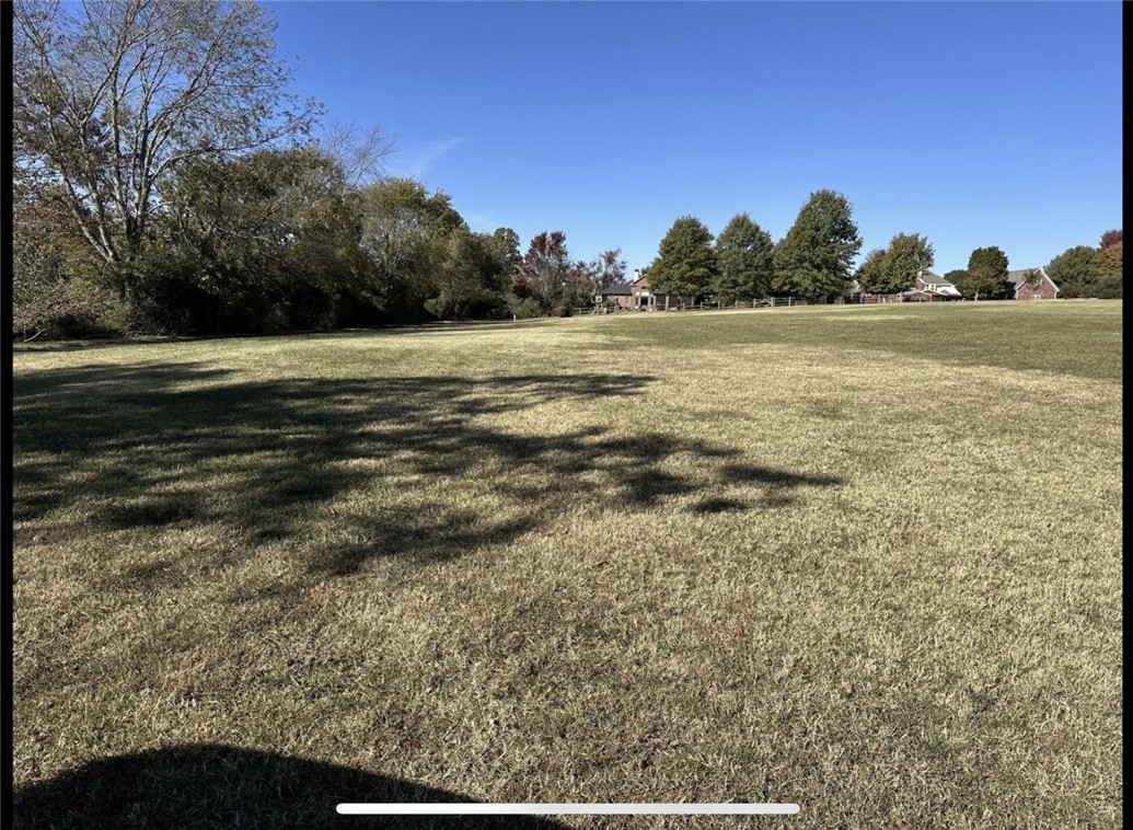 This spacious 2-acre lot at 2249 N Malcolm Ln in Fayetteville, AR offers a blank canvas for your dream home. With no existing structures, you have the freedom to design and build to your exact specifications. The large lot size provides ample space for a variety of outdoor amenities. Located in a desirable area, this property offers privacy and tranquility while still being close to city conveniences. Don't miss this opportunity to create your perfect oasis in Northwest Arkansas.