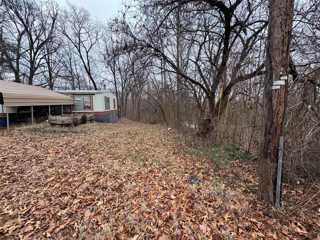Mobile Home near mountain bike trails. Has no electricity. Needs updates and renovation to be habitable. Stripped of electricity.