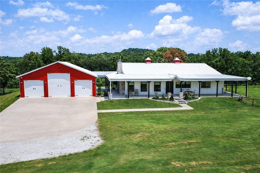 BACK ON THE MARKET!! Welcome to your private country retreat—where modern farmhouse style meets comfort, functionality, and wide-open space. This thoughtfully designed home features a professional-grade Fisher & Paykel 5-burner range with griddle, perfect for the home chef, along with a FamilySAFE storm shelter for added peace of mind. Outdoor living shines with an expansive 1,786-SF covered patio overlooking a fully fenced 5,340-SF yard, ideal for entertaining, pets, or play. Exceptional outbuildings include a 1,480-SF detached garage with three drive-in doors and a 3,430-SF pole shed, offering endless storage, hobby, or workshop possibilities. Set on beautifully maintained acreage with panoramic views, wooded privacy, and a stocked 0.5-acre pond, this truly one-of-a-kind property delivers the perfect balance of luxury, utility, and serene country​​‌​​​​‌​‌​​​‌‌​​​‌‌‌​​‌​​‌‌​​​​ living.
