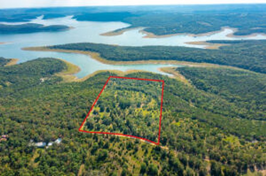Lake View! short drive to 125 Marina. Great Building Site!  Drilled Well and electric available.  Easy walk to water. South line joins U. S. Army Corp of Engineers.