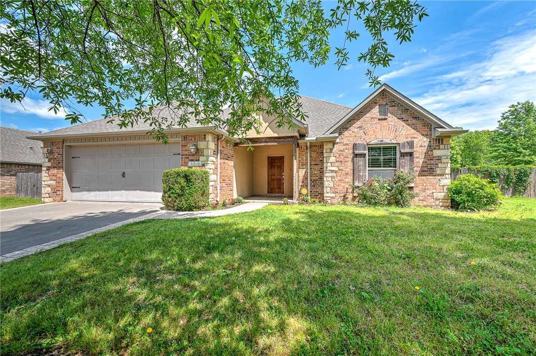 This Gorgeous, One-owner, 3 bedroom 2 bathroom brick home in Mountain Ranch Subdivision is sure to check all your boxes! Freshly painted throughout, and brand new carpet installed in all bedrooms. Other updates include: irrigation system, addition of rear covered patio & front concrete driveway accents, new HVAC units installed a few years ago, and a new garage door in 2021. Bright, open living concept. Split floor plan. Large privacy fenced back yard with room to roam, space for entertaining, and a garden. The covered patio has a hookup for a natural gas grill for endless summer BBQs. All of the bedrooms are large and have walk-in closets with built in organization. The primary bedroom boasts a private en-suite bathroom with double vanity and separate whirlpool tub & shower. Wired for media and sound. Oversized garage. Prime location with easy access to nearby biking & walking trails, a community pool, and close to grocery stores, shopping centers, the UofA, and I-49 for easy commuting.