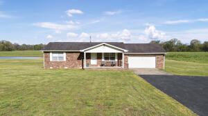 COMPLETELY REMODELD AND UPDATED. throughout. New flooring, fixtures, paint, & vanities, enjoy the updated kitchen with new countertops and appliances. Enjoy the back deck that is accessible from the primary bedroom & kitchen. The 2-car garage is oversized. All of this sets on 38 AC M/L. There is a huge pond that is well stocked, the barn is one that makes people want a barn even if they don't need it! The shop is massive with 2 bays and the lean to is set up for huge air compressor, if that wasn't enough there is another enclosed garage area, the land is pristine perfect and ready for livestock, fenced and cross fenced! Yet it doesn't stop there, how would you like to own part of a creek? Point Remove creek to be precise. Don't let this one get away! SEE PRIVATE REMA