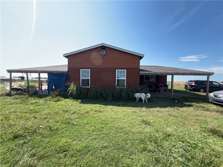 2019 Manufactured home on permanent foundation with 3 Br 2BA and 2 car garage sits on 8.5 flat acres with small corrals, storage buildings and plenty space for animals peaceful rural setting in Summers, just a short drive to Siloam Springs and Fayetteville