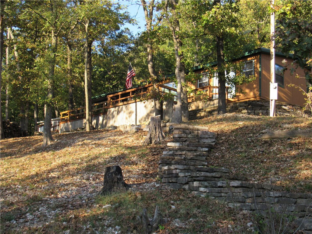 Cute Beaver Lakeview cabin with a Slip in the Community Dock !!!! And you can be on the dock in a couple minute walk from the house. New Central Heat/Air put in 1 year age . Metal roof is only 4 years old. New flooring put in last year. The front of the house has a huge deck and covered porch area. Relax around the fire pit and enjoy the Peace and Quiet. Lots of parking. The Septic system is shared with the neighbor's home. Completely renovated mobile home doubling the square footage.