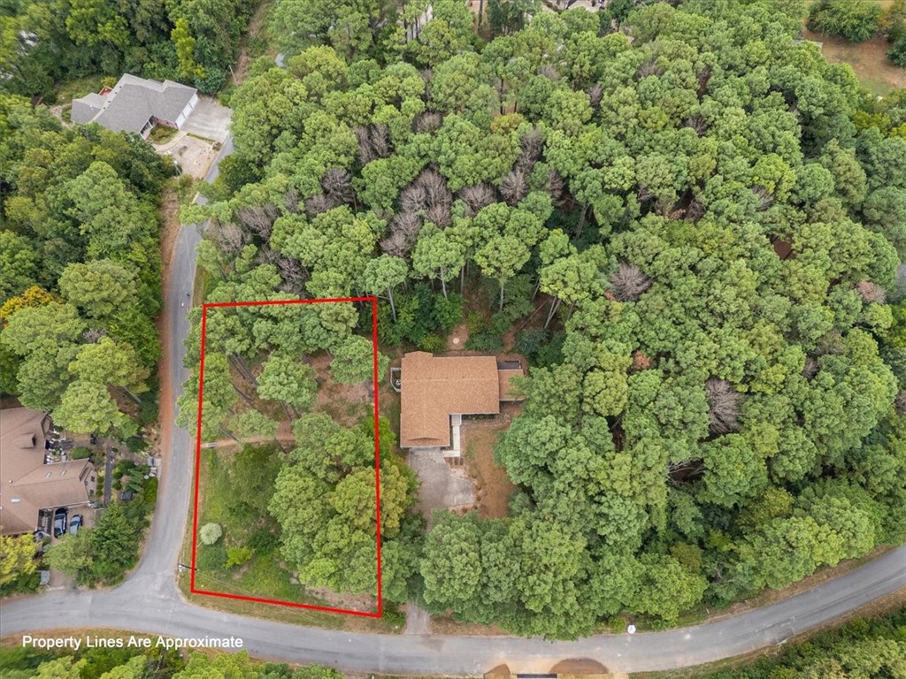Level, large, corner lot on a lovely street with Pine trees galore. Perc test available.