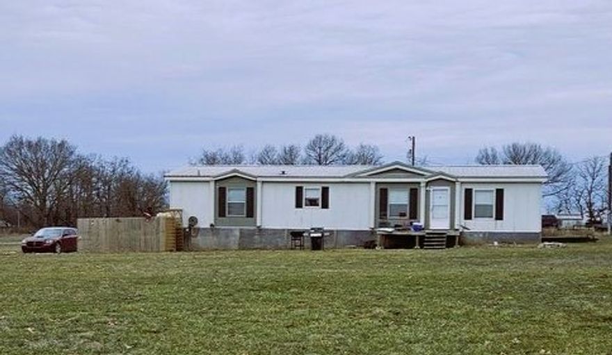 Charming 3-Bedroom Home with Spacious Workshop on 1.86 Acres Nestled on a peaceful 1.86-acre lot in Pea Ridge, this well-maintained 3-bedroom, 2-bathroom manufactured home offers the perfect blend of comfort and functionality. The open and inviting floor plan provides ample living space, while large windows fill the home with natural light. A standout feature of this property is the 30x50 metal shop, ideal for a workshop, storage, or home business. Whether you're looking for extra space for hobbies or practical work needs, this versatile structure adds incredible value to the property. Enjoy the privacy and space of country living while still being conveniently located near local amenities and schools. With plenty of room to expand and endless possibilities, this property is a rare find in the growing Pea Ridge area. Don’t miss this opportunity—schedule a showing today!