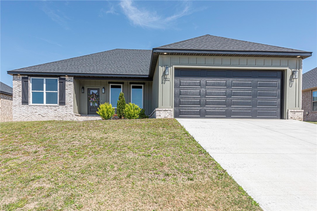 WELCOME HOME! This stunning NEW CONSTRUCTION 3 bedrm 2 bathrm home in the Mountain View Estates is just minutes from downtown Prairie Grove and under 10 mi to I-49 & Fayetteville! From the covered front porch head inside to a thoughtfully designed open concept space: Light & airy living w/ vaulted ceiling & wood beams, LVP floors throughout, dining area, & L-shaped kitchen feat: craftsman styled soft-close cabinetry, 3cm granite counters, stainless steel apps, walk-in pantry, & center island. Relax in the primary suite w tray ceiling & luxury private ensuite feat: separate sink vanities, wood trimmed mirrors, private toilet, soaking tub, walk-in glass shower, & walk-in closet laundry access! Laundry feat: folding counter & storage! Built-in hall tree for addl storage! Split floor plan includes 2 add’l BRs and full BA. Enjoy the comfort of a covered back patio & fenced-in backyard! More Features incl: R42 attic insulation, eve lighting & plugs for holiday lights w/ switch., 8 ft garage door and over-sized garage!