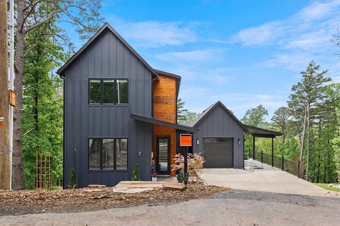 Turnkey investment opportunity in the heart of Bella Vista! This cozy modern 3BR/2BA cottage at 7 Thornbury Ln is perfectly positioned near popular biking trails, golf courses, and Lake Rayburn—making it ideal for Airbnb or VRBO. Featuring updated finishes, an open-concept layout, a private wooded backyard, and a spacious multiple decks, this home offers both comfort and charm. Fully equipped kitchen, and garage storage make it ready for guests or full-time living. Strong short-term rental potential in a high-demand area—use as a vacation getaway or income-generating property!