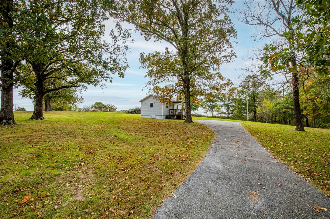 16 x 24 Shop Building, 12 x 16 Storage, 2 By Carport, Fenced, Electric, Some huge Trees, Paved Frontage Road and Paved Driveway, Western Views, room for at least 2 building lots. A great place to build your dream home, let your imagination soar. DON'T FORGET TO SEE THE VIDEO.
19 Minutes to the Bentonville Square. Crystal Bridges,