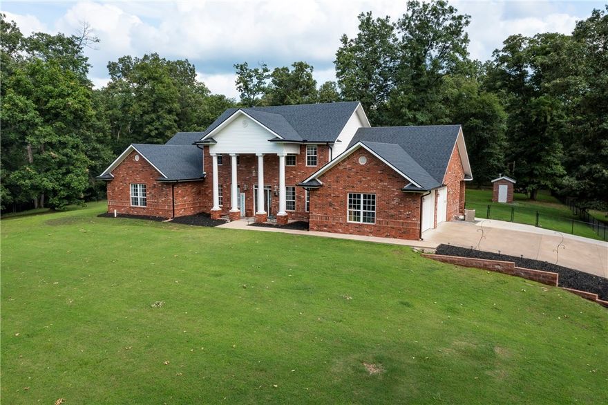 This stunning home features high ceilings, recessed lighting & crown molding, granite kitchen countertops, tile backsplash & ample counter space creating a polished look. Open floor plan allows for easy flow between the living room, dining area, & kitchen, great for entertaining. Bedrooms are generously sized & offer plenty of closet space, ensuring ample storage for all your belongings. Natural light floods the entire home, creating a warm & inviting ambiance. Covered patio is a perfect spot to relax & enjoy the peaceful countryside. Whether you're hosting a gathering or simply enjoying a quiet evening this space is perfect for outdoor entertaining. A large unfinished room upstairs can be finished into additional bonus room. 30X30 shop provides plenty of storage for all your tools and equipment. This home offers country living, while still being conveniently located near Tontitown, XNA, Siloam, Rogers, & Springdale. Don't miss out on this opportunity to own a home that combines modern convenience & country​​‌​​​​‌​‌​​​‌‌​​​‌‌‌​​‌​​‌‌​​​​ living.