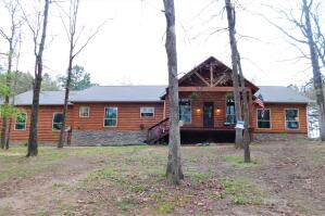 What a gem! Dreaming of a little land on the outskirts of town? Wishing you had a large shop? Would you love to have your morning coffee on your covered front OR back porch? You can have it all in this 4 year old log sided beauty! Large master suite, beautiful kitchen with walk in pantry, separate office, and two additional bedrooms round out this impressive home. Soaring tongue and groove ceilings, Extra large windows, custom closets and great details throughout. Schedule your tour today!