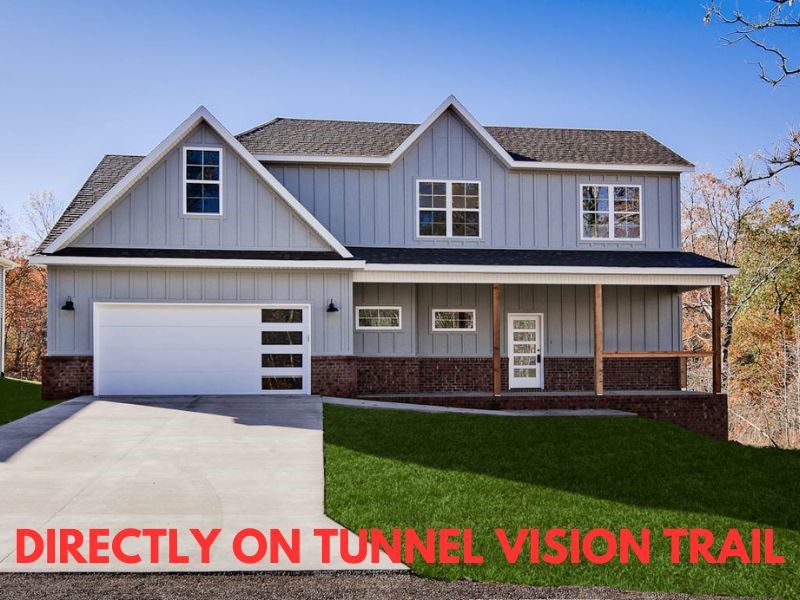 New construction with bonus room on a wooded lot directly on Tunnel Vision Trail! This stunning property offers the perfect blend of nature and nearby amenities. Conveniently located close to Lake Windsor and provides easy access to Bentonville. Step inside to discover a beautiful fireplace, custom cabinets, elegant 3 cm countertops, and high-end finishes throughout. The striking large waterfall kitchen island and gas range is perfect for culinary creations. Beautiful hardwood floors flow throughout the main level, complemented by a stunning wood staircase that adds character and charm. This thoughtfully designed home features 3 spacious bedrooms plus a versatile bonus room, providing ample space for relaxation. The primary bedroom is conveniently located on the main level, ensuring comfort and accessibility. Bentonville schools. Donāt miss the opportunity to make this beautiful property your ownāschedule a showing today!
