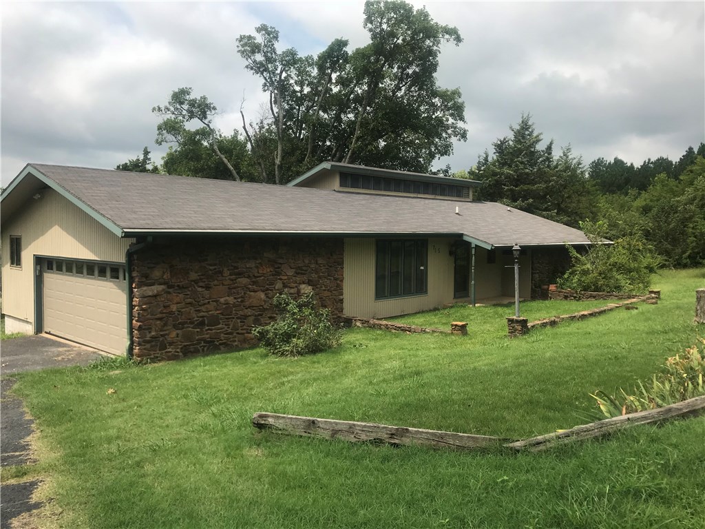 Convenient location on 1.94 acres. Home features a large stone fireplace in the family room with a spiral staircase leading to a loft area. Large kitchen with an island. Mud room area. Formal living room. Sitting/Sunroom overlooking the large backyard.