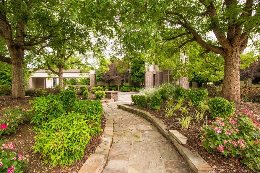 Custom retreat located in the highly sought after gated community of Beau Chene. This one level modern home offers 4 bedrooms, 2 living areas, open gourmet kitchen, gentleman's study, media room & a wine cellar. The master suite provides scenic views of the pool, a fireplace, his & her's bathrooms and spacious walk-in closet. This fabulous property with over 7 acres offers plenty of room to entertain and enjoy the gunite pool and cabana area. Prime location across from Pinnacle Country Club.