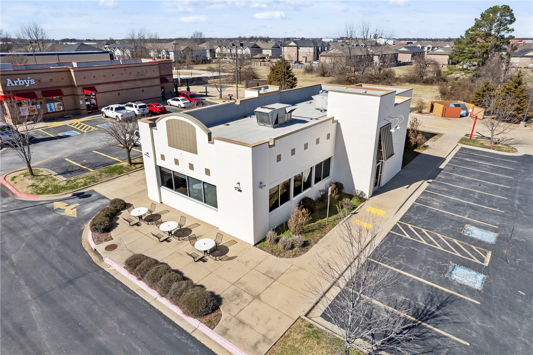 Prime QSR drive-thru restaurant building for sale in a high-traffic location in Springdale, AR! This +/- 2,980 SF freestanding building is just 1.5 miles from I-49, the region's main interstate, offering exceptional accessibility and exposure. Positioned directly off Sunset Ave, which sees approx. 35,000 VPD, the property provides excellent visibility for any quick-service restaurant or food concept. The building features a spacious dining area, a convenient drive-thru window, a large kitchen, manager's office, walk-in coolers, and two public restrooms. Additional highlights include ample customer parking, an outdoor seating area, dual entry/exit points for easy ingress and egress, and a TPO roof. This is a turnkey opportunity for anyone looking to establish a strong presence in the heart of Northwest Arkansas.