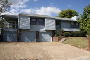 Located on the edges of the golf course is this 3 bedroom, 2 1/2 bath home. This home includes a 3 car garage which perfect to store both your vehicles & your golf cart. The home also includes a master suite with personal deck, deck off the dining room, fenced back yard, and a beautiful view of the course. The walkout basement has a spacious den with a wood burning stove and a wet bar.