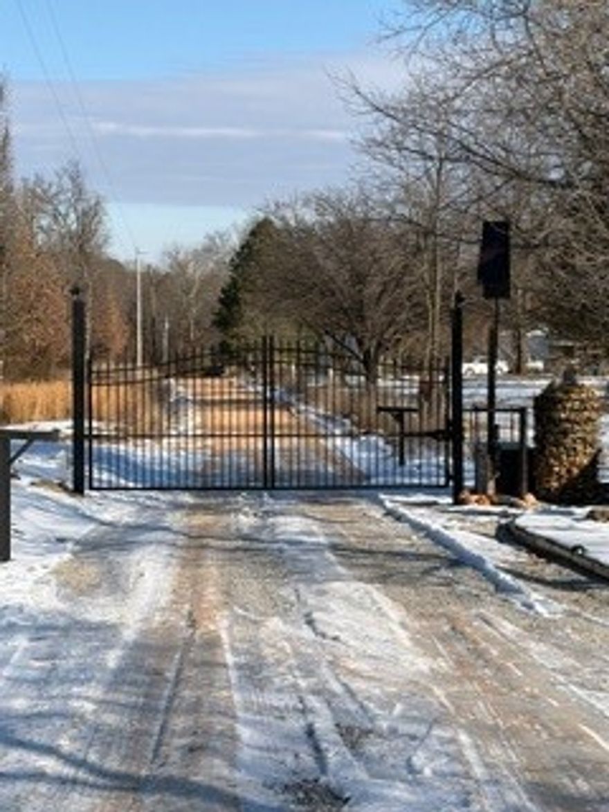 A multi-use property. It's outside the norm. Rental Income? Family compound? This gated 10 acre property host an upscale 2 br/2 bth barndominium main residence with an adjoining covered RV pad 18 x 56 with full hookups. A detached metal shop building apprx 3,000 sf, insulated, with kitchen, 2 bath and laundry, chain hoist, 2 woodstoves and AC.  24 x 90 Greenhouse with Thermal air system, fans and lights. There are 10 RV pads with full hookups,4500 gal septic, and 4 additional homesites currently occuppied The 4 additional privately owned homes might be available to purchase separately. That's a potential rental of 14 full service setups at $500-$750/month per site. New pond with aereation system and a large basement foundation started for an additional building pad. Shooting range and lots of additional space for added uses. Qualified buyers only please.Financials requested.
Pictures to be updated when weather permits. Also listed as a commercial property.