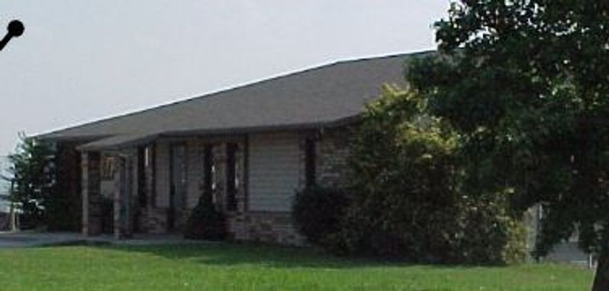 2416 SF building w/2192 SF office and 224 SF garage area. Situated on 9.69 acres. Zoned C-2. 1 drive in door. City utilities.