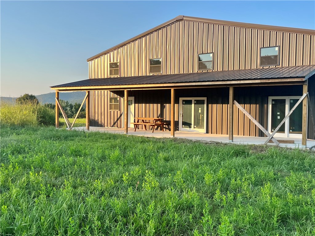Location! A RARE opportunity to own a 100 acre Barndominium Homestead Located in Crosses off HWY 16, the famous āpig trailā 20 min to Fayetteville & quick access to White River. This beautiful acreage boasts magnificent views, 20 acres pasture, 80 acres woods, a 3000 sq ft mid-construction barndo including 1575 sq ft attached workshop, 1 large overhead & 1 reg garage door. An open floor plan w soaring ceilings. Kitchen w/extra large pantry & island open to a Great Room & Loft. Mud rm, Utility rm adjacent & a very generous Primary Suite just off the Great Room. 2nd floor features a 2nd living space w bed/bath, lg. library & loft. See floor plan attached. Natural gas, electric, water tap & well already in place. Breathtaking creek perfect for cooling off during hot summer days, or for perch & bluegill fishing. So much of the work is already done for you! For your recreation, the timber found throughout creates an amazing habitat for deer, turkey, black bear, and much more! Come see this hard to find acreage in NW AR.