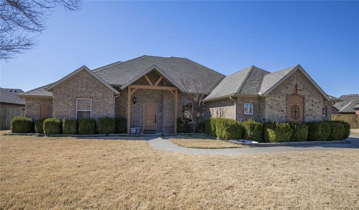 This Dream Structures custom home features custom cabinets, built ins, granite, crown molding, SS appliances, gas stove, tiled shower, blinds, gutters, fence, community pool and clubhouse. This home is very close to award winning schools. Zoned for Willowbrook elementary, Brightfield middle, Fulbright Jr High, and Bentonville High School. This was model home and is loaded with extras. Located in desirable Wildwood subdivision. Agent owned.