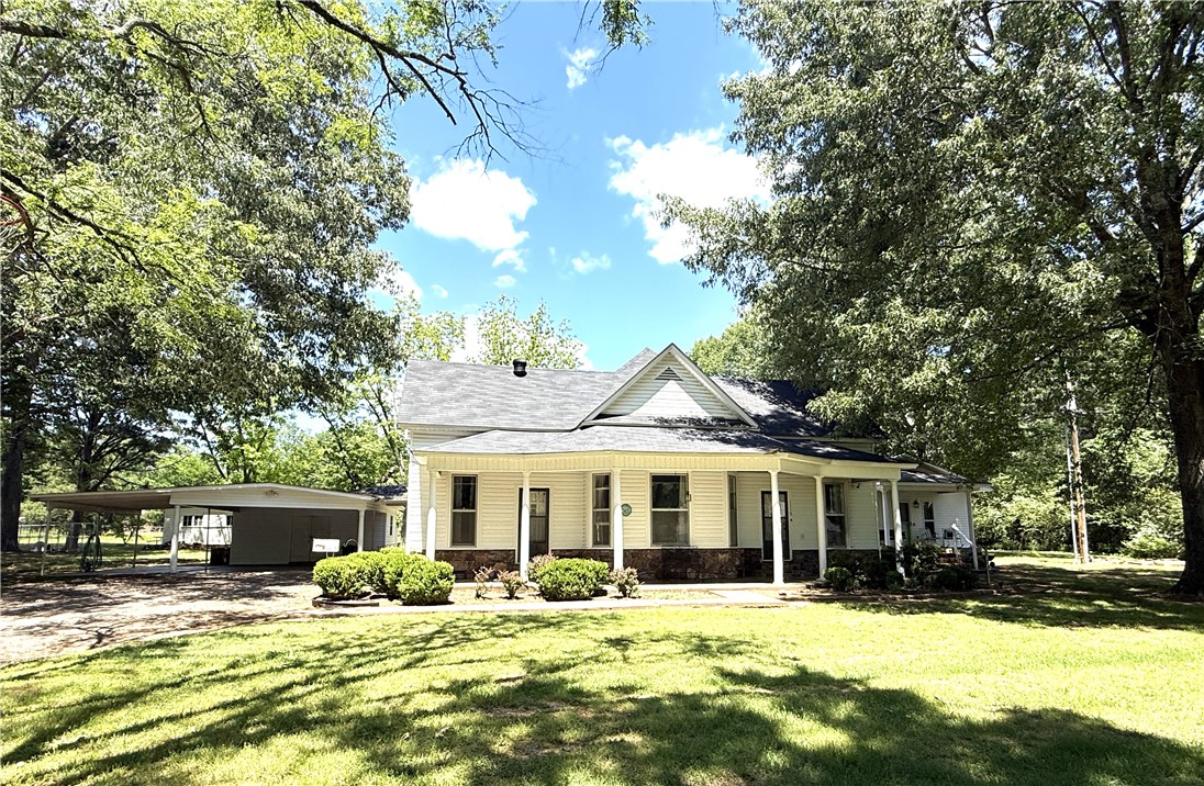Nestled on a full acre, this unique property offers two homes in one—ideal for multigenerational living, rental income, or guest accommodations. The main residence features 2 spacious bedrooms, 2 full baths, and a versatile bonus room and other spaces perfect for an office, playroom, or additional bedroom. The attached but separate mother-in-law suite offers private living with its own entrance, bedroom, kitchen, and bath—providing comfort and flexibility for extended family or guests. You’ll fall in love with the home’s character: warm details, inviting living spaces, and picture-perfect setting. The property also includes a detached carport with workshop area, a functional outbuilding perfect for additional storage, and plenty of outdoor space for gardening, relaxing, or entertaining. Conveniently located just minutes from town amenities, this one-of-a-kind property is ready to welcome you home.