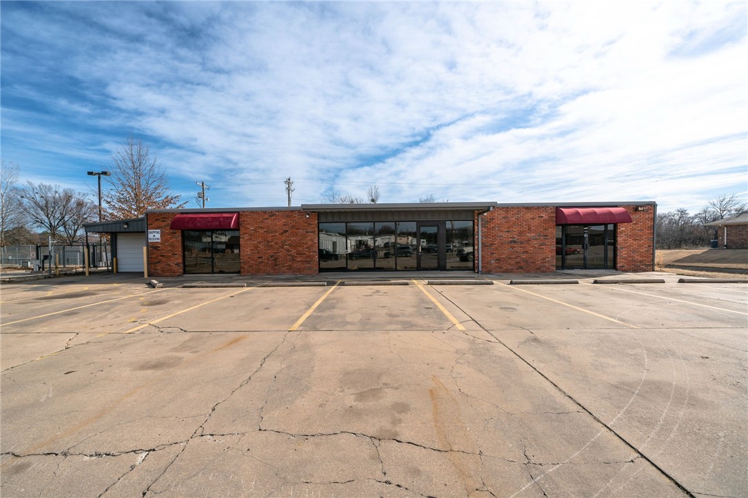Well maintained building minutes from Hwy 540. Building features a large showroom, LED lights throughout, central HVAC, tall ceilings in back storage room, 2 offices and 2 restrooms. Building has approx. 600 sq/ft of shop area with roll up door entrance. Building was previously used as a tire shop. Agent Owned. Zoned C-5.