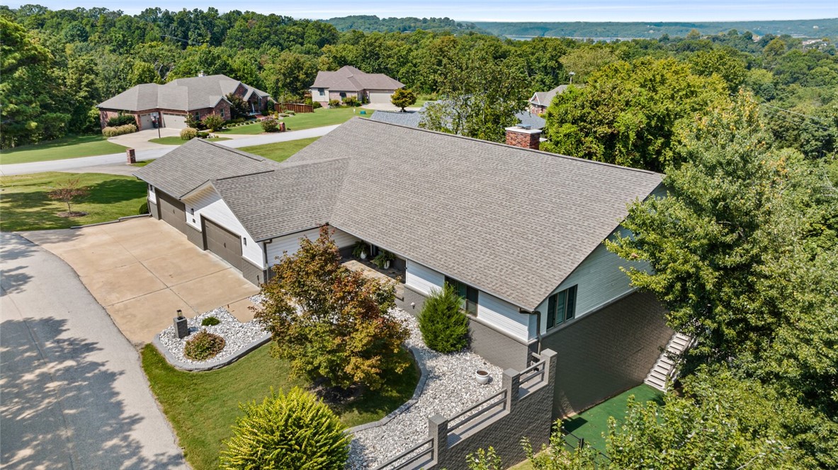 The views of Beaver Lake from this home are stunning! This 4 bedroom, 4 1/2 bath two level home is spectacular, with two decks spanning the rear of the home and modern finishes throughout. If you're looking for a home with two primary suites, this is it! Located in the Crow's Nest subdivision you can have the best of both worlds: the convenience of living close to downtown Rogers and all that it has to offer, yet you'll get a sense of serenity that the Beaver Lake area provides. Close to parks and just a short drive to the lake. Recent improvements: home exterior recently painted, updated outside lighting and new front door, fresh interior paint throughout, updated cabinet facings and more. New roof in 2019.
Your lakefront retreat is waiting!