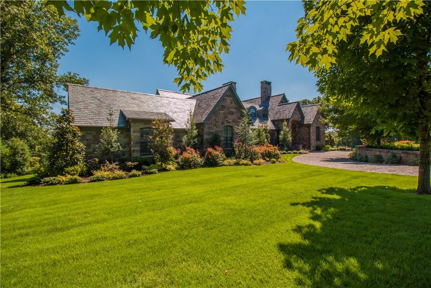 Poised on a private picturesque lot in the gated PCC subdivision, this stone estate defines French charm. Custom designed & completely remodeled in 2014 with leading edge designs & housewares. Distinguished design elements include; Brazilian cherry/slate/marble flooring, custom millwork, hand carved limestone FP, wood plantation shutters, vaulted cathedral/coffered/wood beam ceilings, marble countertops, an elevator, antique solid wood French doors, designer closets, and Savant integrated smart home.