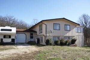 Country living - 3 to 4 bedroom, 2 full bath home situated on 3.16 acres m/l with 2 car attached garage, plus a 2 car detached workshop. Includes a back up generator. Home is heated with Hydronic Baseboard Heat.