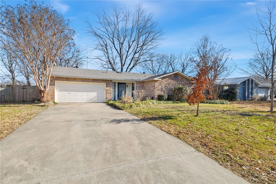 This well-maintained, one-level, mostly brick home is located in one of Fayetteville’s most sought-after neighborhoods. Just 4 miles from the University of Arkansas, the neighborhood features a bike lane at the entrance with access to the Razorback Greenway Trail less than one mile away. Washington Regional Medical Center is also under a mile from the home. Walk to grocery stores, restaurants, a movie theater, and nearby shopping.

Recent updates include a new roof, water heater, and HVAC system with a new A/C condenser installed in 2024. Ceramic wood-style tile flooring flows throughout much of the home, creating a cohesive, low-maintenance living space. The updated kitchen offers new appliances, a farmhouse-style sink, stylish backsplash, and butcher block countertops. Fresh interior paint in calming earth tones adds warmth. The oversized lot features mature trees, thoughtful landscaping, and a fully fenced backyard. A fully insulated garage provides flexible space ideal for a home gym, workshop, or hobby area.