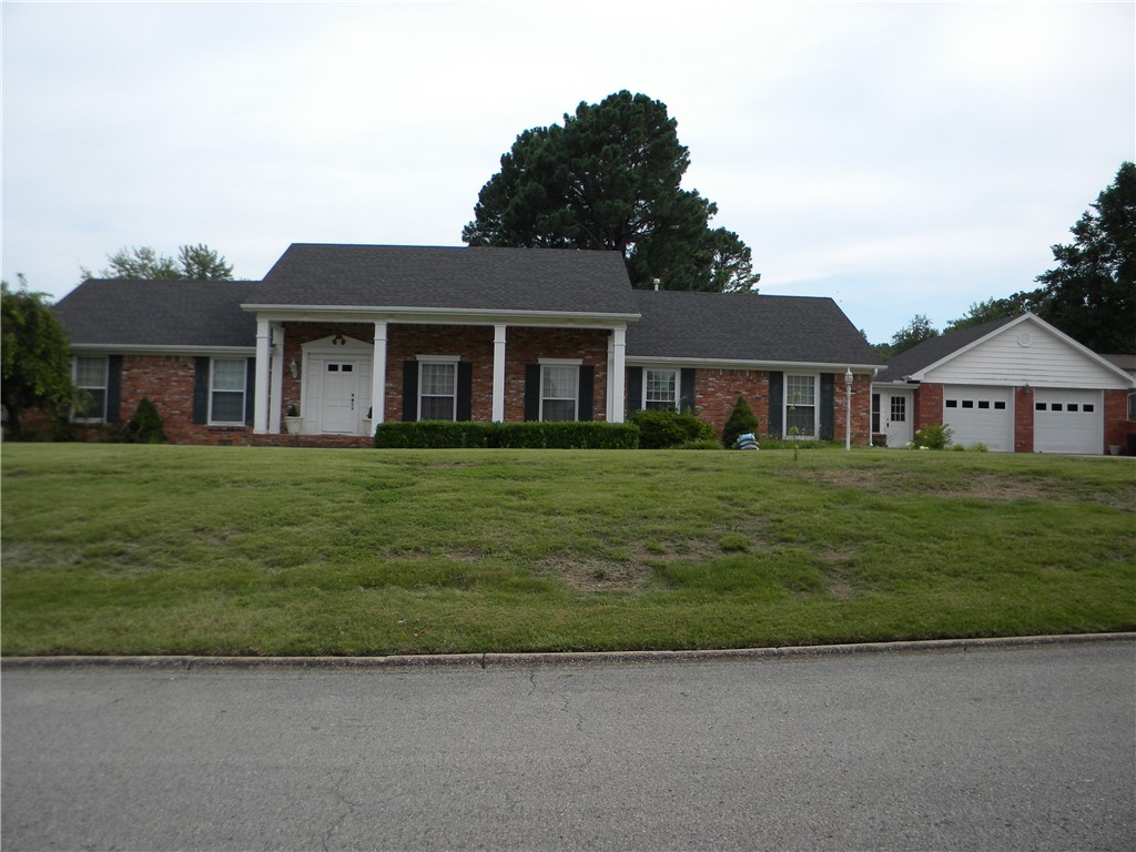 SLEEPING BEAUTY! One level, 4 bedrooms and large .49 acre,flat lot in one of the most desirable neighborhoods in Fayetteville. Roof is appx 5 years old. West side of home's A/C is 16 yrs old. East side of home's A/C is 1 year old. Furnace is about 5 yrs old. Duel 20 gallon electric water heaters on east side. They are set up sequentially. The one on the west is gas "instant" hot water. All Water heaters are appx 16 yrs old. Easy walk to Butterfield Elementary School, shopping, restaurants, hospital and Hwy #49.
Large patio is covered with a pergola. Estate sale is scheduled for September. Home is to be sold "as is".