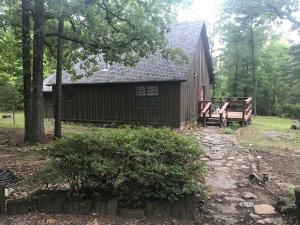 BEAUTIFUL VIEW OF NATURE in this secluded, rustic home. Would be a great home for someone who wants privacy or a perfect getaway cabin with motor home hook-ups on the property. Two bedrooms, 2 baths. Kitchen has new appliances and master bath has been updated. Spacious wrap-around deck is the perfect place to enjoy the wooded privacy.
