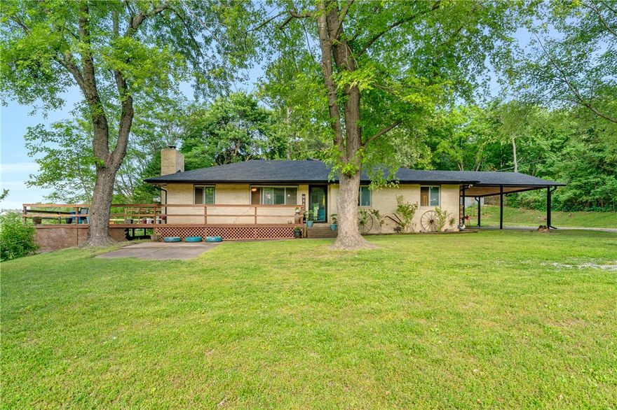 Spacious home in Springdale offering a blend of comfort and peaceful surroundings on 5+ acres. Step inside to a large living room, the perfect focal point for relaxing evenings or gathering with guests. The kitchen offers generous cabinet storage, ample counter space and a functional layout that connects seamlessly to the dining area, along with a pantry and convenient eat-in space for everyday meals. Primary bedroom provides a comfortable retreat, while two additional bedrooms offer flexibility for family, guests, or a home office. Enjoy outdoor living with a patio, deck space and scenic surroundings with room to relax and appreciate the outdoors. The property also features a 30x40 shop with concrete floors, electric and well water, while the home is connected to city water, along with a small barn, storage building and chicken coop for added versatility and country charm. Conveniently located with easy access to schools, parks, dining, shopping, and major roadways while still offering a peaceful setting.