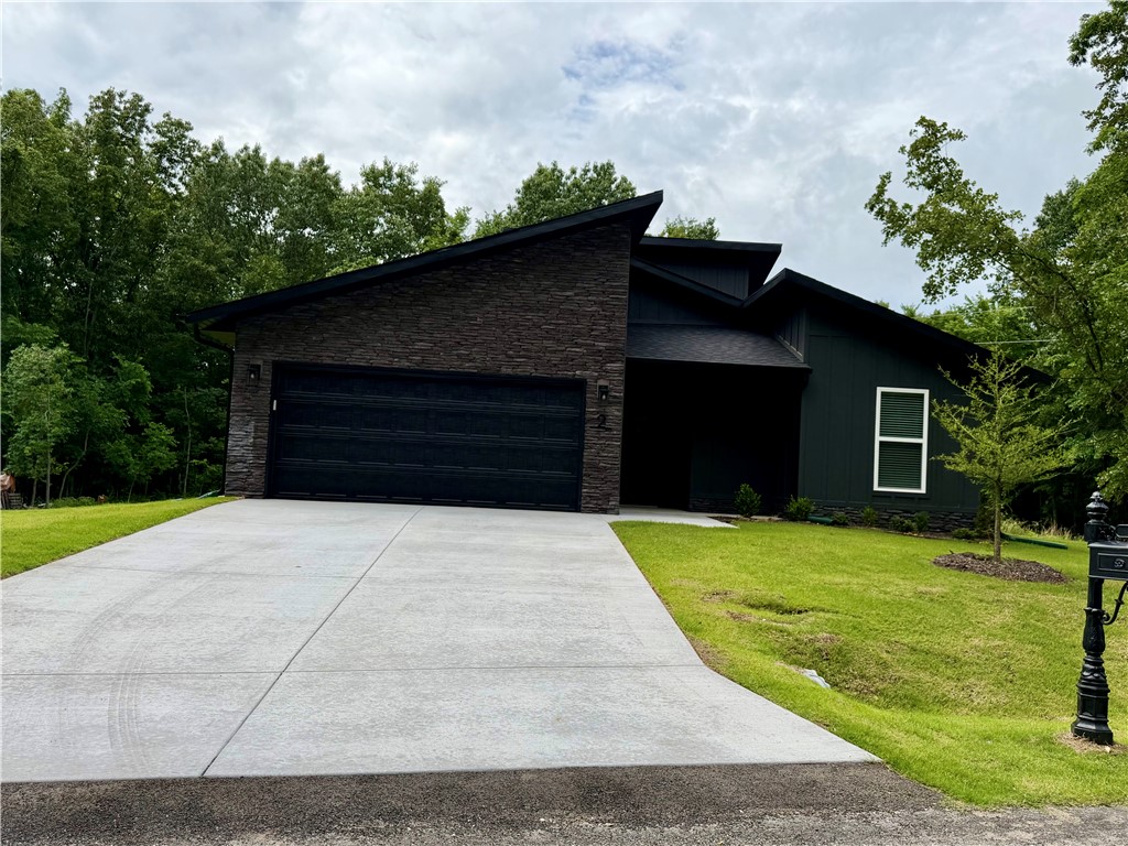 View of front of home with an attached garage, boa