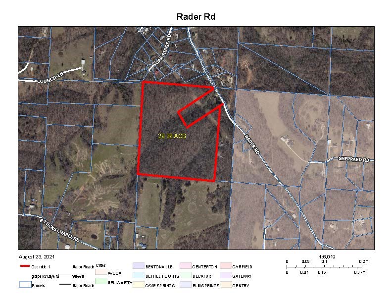 Country living but only 4 miles to downtown Rogers. This private wooded 29+ acres is a wonderful site to build your dream home and enjoy hunting, four wheeling, horse back riding and peace and quiet. Property was surveyed into 5 (5-6) acre lots so you can keep it all or sell what you want. There is also rural water on Rader Rd. Also would be a good place to build small VRBO cabins or tiny homes (no restrictions). Currently no street address but you can use 921 Rader Rd (Neighbor). The property is also near Big Sugar Golf Club about a mile away.