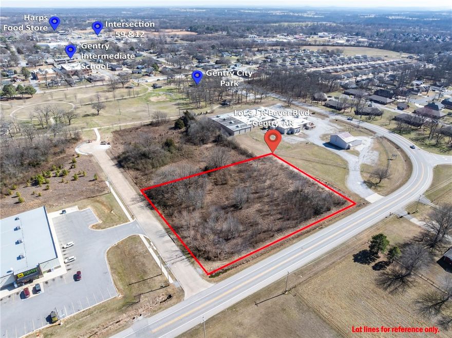 Prime 1.87-acre commercial development opportunity located in the heart of Gentry’s growing business corridor on J R Bever Blvd. This level, high-visibility lot is shovel-ready with public water already at the street, making it an ideal site for retail, professional offices, or a service-based venture. Strategically positioned among established local businesses, this property offers a perfect blend of local community charm and regional accessibility. Located just a short drive from the booming hubs of Bentonville and Rogers, and providing quick access to the Northwest Arkansas National Airport (XNA), this lot is perfectly situated to capture the rapid growth of the NWA region. Don't miss your chance to secure a substantial commercial footprint in a high-demand area!