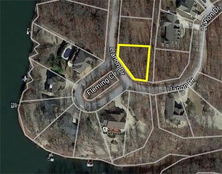 2nd row back from Lake Brittany (Bella Vista's Trout Lake) at Fleming Cir in area of nice lake homes. .24 acre lot w/gentle upslope may have winter lake view.