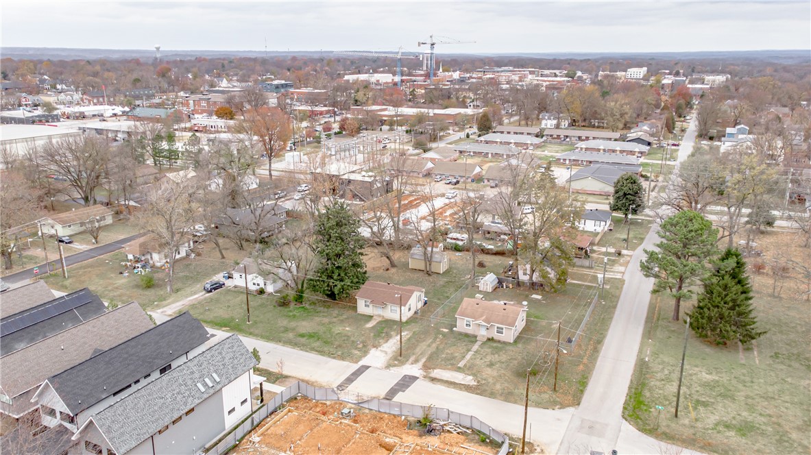 Value is in the land! Must be sold with MLS #1166871. Amazing property in a prime location right off 8th street and near Thaden School. Less than 5 minutes away from The 8th Street Market, The Momentary, Downtown Bentonville, Skylight Cinema, and amazing restaurants. There is so much potential here on this half acre. Come build your luxury downtown dream home!