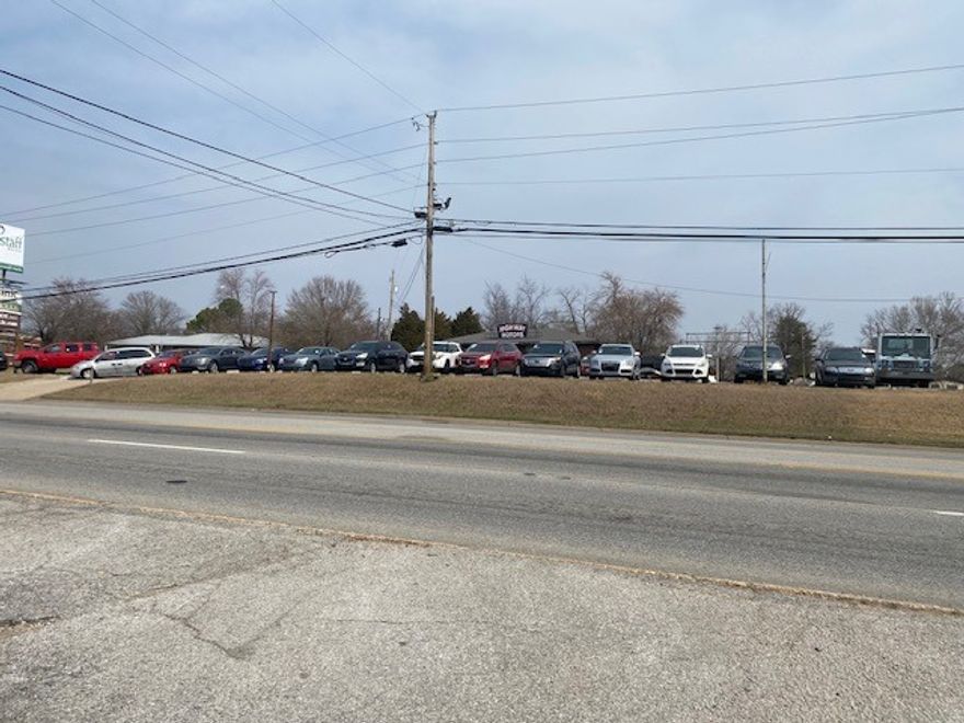 Terrific potential with this residential rental with 6 units total plus retail space currently used as a car lot.  All utilities available.  Highway frontage on busy Hwy 65.  Great place for anything retail.