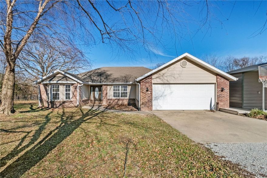 Enjoy the perfect balance of space, privacy, and convenience with this home situated on over 2 acres in the Bentonville School District. Offering a peaceful, rural living feel, this property provides room to spread out while remaining close to everything Northwest Arkansas has to offer.  Inside, the home features a comfortable and functional layout with inviting living spaces ideal for everyday living. The kitchen offers ample cabinetry and workspace and flows easily into the dining area, making it well-suited for gatherings. Bedrooms are generously sized, with the primary suite providing a relaxing retreat at the end of the day. The expansive acreage offers endless possibilities for outdoor enjoyment, gardening, or simply taking in the quiet surroundings. A detached carport with workshop or additional storage space adds tremendous value, perfect for hobbies, tools, equipment, or extra vehicles.