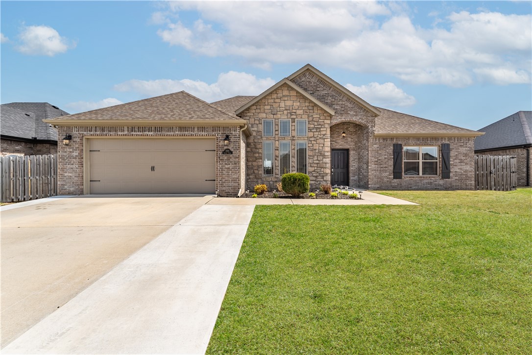 This beautiful 3 bed 2 bath home is located in the highly desired Sunrise Ridge Subdivision that's walking distance and zoned for a top ranked high school in Arkansas, Bentonville West. This home offers leather granite in the kitchen, trendy shiplap fireplace in the spacious living room, beamed ceilings, plenty of natural light, additional concrete padding on the front driveway and on the back patio, outdoor fireplace, and a large shop in the backyard that stays for the buyers. **$1,500 preferred lender credit** Schedule your showing today!