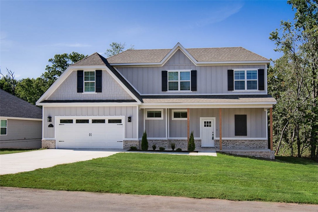 New construction on TUNNEL VISION TRAIL! Large level .30 acre lot with wooded views. Features include 331 sq ft of floored unfinished attic space w/ easy access (no need for a storage unit!), LVP throughout, 3 cm granite counters, 10' ceilings, custom cabinets w/ wood hood, oversized kitchen, gas range, pantry, walk-in tile shower, fireplace, built-ins, 2 covered patios, & high-end finishes throughout! Bentonville schools. Approx completion date is 3/1/24