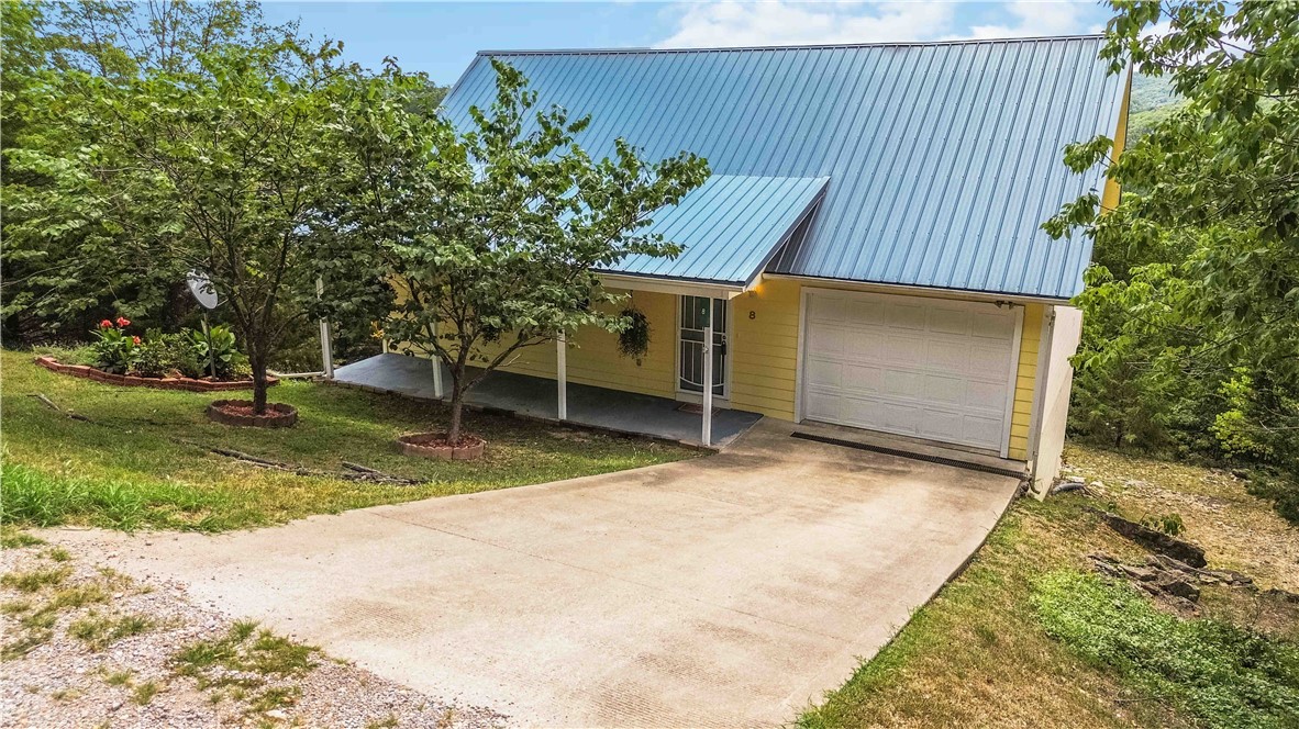 A Nature Lover’s Dream! ????
Tucked into the scenic hills of Holiday Island with a breathtaking view of the Ozark Mountains, this charming home is Turn-Key Ready for your next chapter. Enjoy the perfect balance of privacy and convenience—just minutes from Table Rock Lake and only 15 minutes to Eureka Springs. Spend your weekends exploring all the amazing things the Ozarks has to offer or drinking coffee on your deck with an amazing view.
This well-maintained 2 bedroom, 1 bath home features a beautiful deck where you can relax and soak in the stunning mountain view. A one-car garage and storage space under the home provide extra functionality. Recent upgrades include a brand new HVAC system with heat pump, new water heater, and new sliding glass doors, new dishwasher and washer & dryer—it’s like stepping into a brand-new home!
Whether you’re looking for a starter home, a vacation getaway, an investment property, or a retirement retreat close to the lake, this property is a must-see.