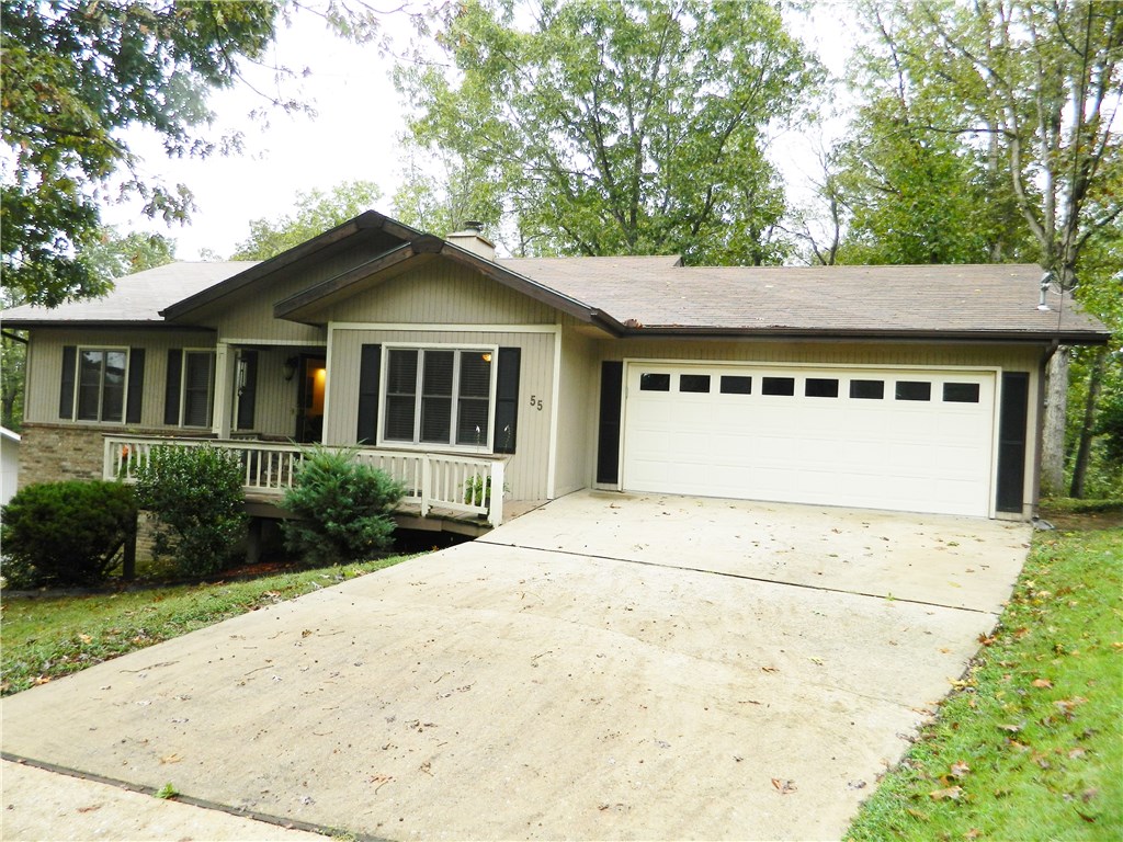 Newly updated home,excellent location on .33 acres. Easy access to Bentonville, schools, golf, clubhouses, lakes, trails & I49. 32x24 heated&cooled shop under house w/separate entrance. Bright spacious home boasts a beautiful back yard with extensive decking, gorgeous 358 sq ft sun room, gas log fireplace. Updates include fresh paint, flooring, light fixtures and newer water heater, roof, appliances, H&A, & exterior paint. Septic recently pumped. You will love the serenity, space and charm of this home.