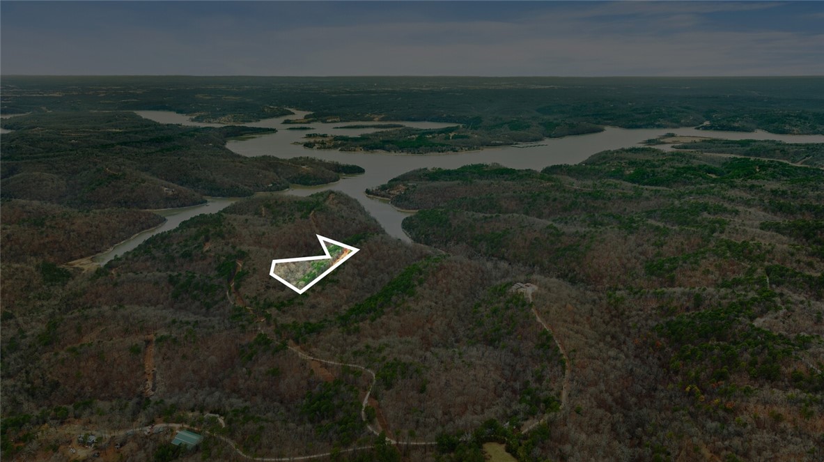 Discover the perfect canvas for your dream home with this stunning 5-acre tract in Emerald Bay subdivision. Boasting breathtaking views and endless potential, this property offers a serene retreat near the lake. While well water and septic are needed, electricity is already on-site, making your building process more convenient.
Located just minutes from the historic War Eagle Mill and a short drive to downtown Rogers, youāll enjoy the perfect balance of peaceful living and easy access to amenities. Whether youāre envisioning a custom home or a weekend getaway, this property provides the ideal setting to bring your vision to life. Donāt miss this rare opportunity to own a slice of Emerald Bay!