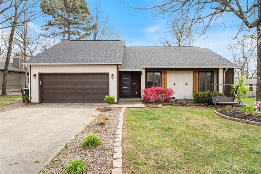 Beautifully renovated lake area home located in picturesque Holiday Island. This single level 3 bedroom 2 bath home has a flawless flow from room to room and sits adjacent to the championship golf course, just around the corner from the clubhouse. The rooms are all spacious and the addition of the sunroom adds so much natural light to the space! Cozy up this winter in front of the glowing fireplace and enjoy settling into your new life in the Ozark Mountains. There have been numerous upgrades in the last five years including a brand new roof, water softener & hot water heater, dishwasher, microwave with air fryer, new flooring, a rear deck for outdoor barbecues and even a complete crawl space encapsulation to secure your investment for decades to come. This home has all new systems and is absolutely move in ready and waiting for you to make it your own. When summer rolls around you will be just minutes from Table Rock Lake, the Marina and only a few short miles from the vibrant arts community of Eureka Springs.